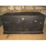 A vintage dark stained pine carpenters tool chest with hinged lid revealing a partially fitted and