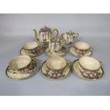 A collection of early 20th century Satsuma tea wares with painted wisteria and other floral