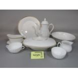 A collection of Royal Doulton Gold Concord pattern wares number H5049 comprising a pair of tureens