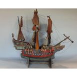 Scandinavian scale model of a three mast galleon with various painted highlights and canons, etc