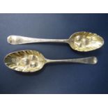 Matched pair of Georgian berry tablespoons, the gilt scalloped bowls embossed with bright-cut