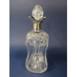 Good quality cut glass dimpled waisted decanter with star-cut decoration and lobed silver collar,