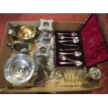 A box containing a small quantity of silver plated items comprising pair of candlesticks, cream