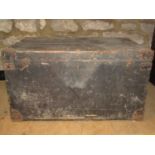 A vintage stained pine chest with hinged lid and iron fittings