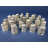 A collection of 29 silver or white metal thimbles to include at least five examples by Charles