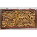 A good quality chinese carved hardwood panel, three dimensional work depicting a marriage scene with