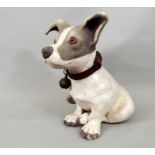 A studio pottery figure of a seated terrier, 30cm high