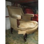 A Victorian drawing room chair with upholstered seat, back and arm pads raised on showwood turned