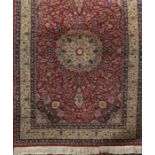 Good quality Keshan rug with central floral medallion, framed by further scolled foliage upon a