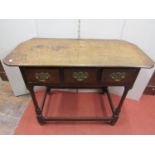 18th century oak Countrymade side table, the rectangular top with shaped corners over three drawers,