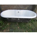 A cast iron and enamel roll top bath with central tap fixings approx 175 cm long x 82 cm wide