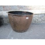 An old copper with flared rim and riveted seams, 58 cm diameter approx