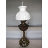 Brass Corinthian oil lamp with opaline glass shade, 64cm high including flue