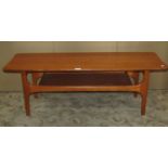 A retro teak Long John type occasional table of rectangular form with simple moulded outline and