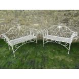 A pair of contemporary lightweight cream painted steel two seat garden benches in the Regency