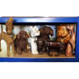Seven comical dogs in papier mache, carved hardwood, straw work, etc, 37cm max