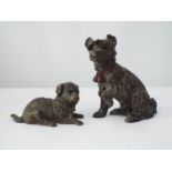 A Victorian bronze inkwell in the form of a terrier, with hinged neck, together with a further