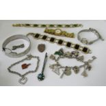 Mixed lot of costume jewellery to include a silver hinged bangle with engraved decoration, a