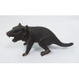 A bronze figure of a snarling animal, 13 cm in length