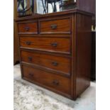A late Victorian mahogany bedroom chest of two short over three long graduated drawers with