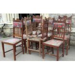 A set of eight (6&2) Edwardian Arts & Crafts style dining chairs with shaped splats, upholstered