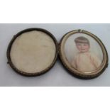 Early 20th century British school - Half length miniature portrait of a brown eyed boy with brown