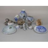 A collection of Royal Copenhagen ceramics including models of a bear cub no 1124, a squirrel no