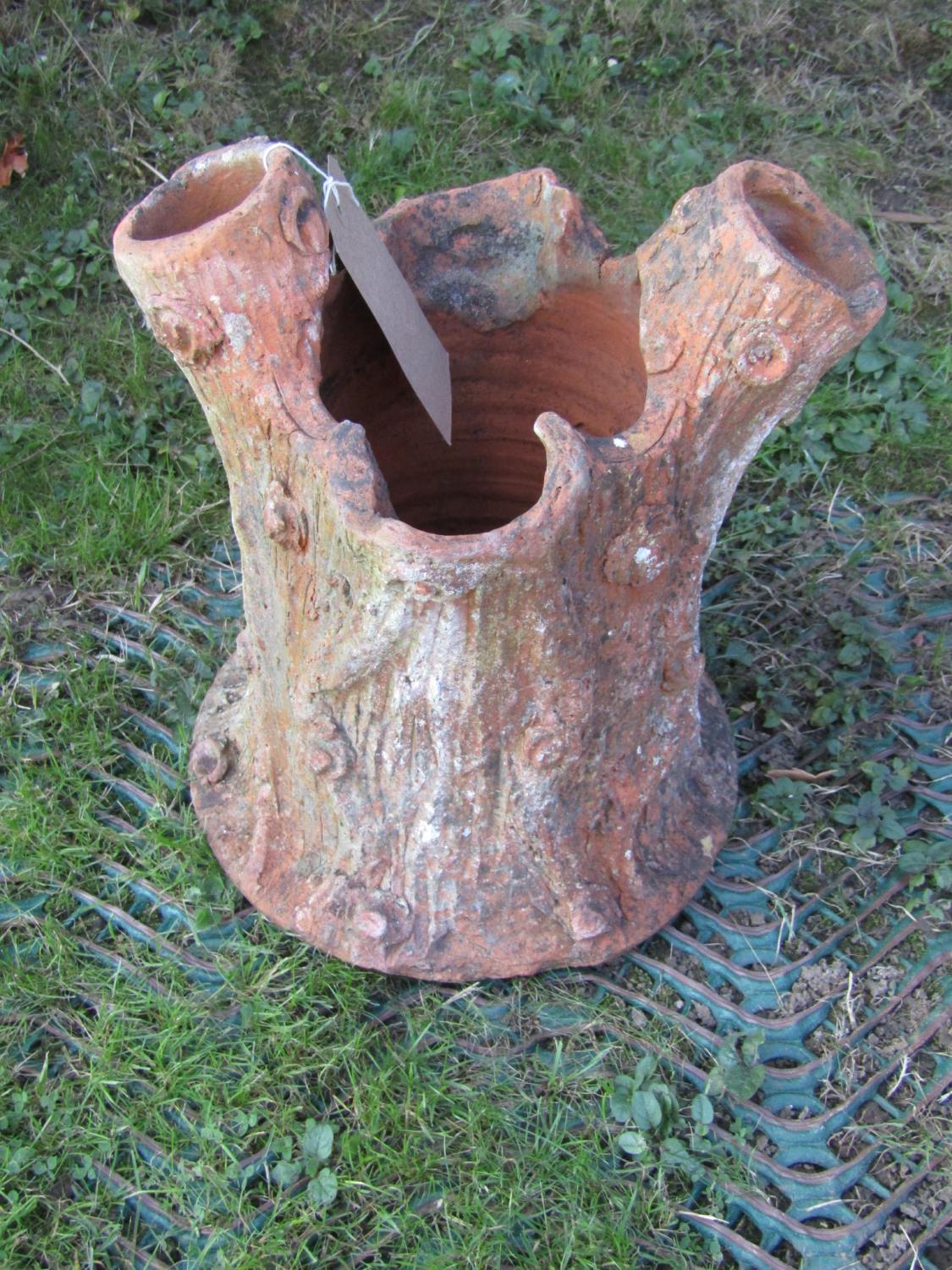 A small naturalistic novelty terracotta planter in the form of a tree stump, 33cm high