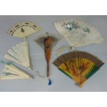 Collection of fans including two ivory brise fans, a carved Sorrento style fan with mirror, eight