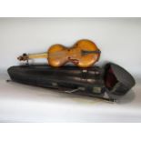 Interesting cased violin, of curved form, together with bow and carry case, 61cm long (af)