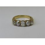 Good quality antique 18ct pearl and diamond five stone gypsy ring with scrolled mount, setting width