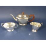 1930's Georgian style silver octagonal boat shaped tea service, comprising teapot, milk jug and