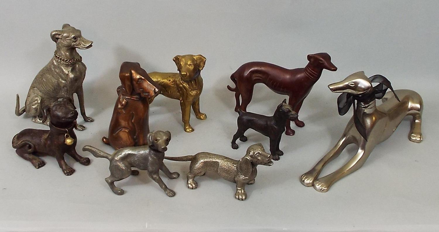 Nine metal figures of dogs including Dachshund, Terriers, Labrador, Greyhound, etc, 18 cm and