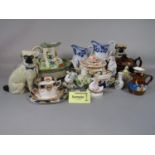 A quantity of 19th century and later ceramics including two hollow cast model Pugs, copper lustre