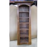 A contemporary Arts & Crafts style hardwood freestanding open bookcase of tapered form with fixed