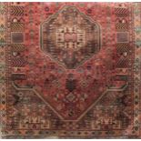 Good quality Afghan full pile rug decorated with various still life scenes and a central medallion