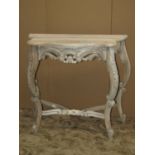 A bleached pier table with serpentine outline, scrolled acanthus frieze and supports united by