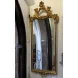 A reproduction Georgian style wall mirror, the gilt moulded frame with C scroll, acanthus and
