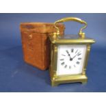 Attractive brass dwarf carriage clock, with turned pilaster case, 9.5cm high, with Morocco leather