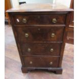 A small walnut veneered chest of four long drawers in the Georgian manner, the drawers with cross