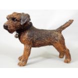 A studio pottery figure of a terrier by Joanna Cooke, 23cm high
