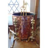 Good quality planished copper log bin with riveted bands, together with a further brass fireside set