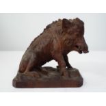 A good timber carved figure of the Calydonian Boar on naturalistic base 20 cm in length