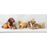Eight carved timber models of dogs including Bulldog and other breeds, 28 cm and smaller