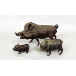 A late 19th century cast spelter model of a wild boar, with two small bronze pigs