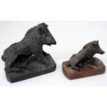 A carved serpentine figure of the Calydonian Boar and a further smaller version in bronze on a