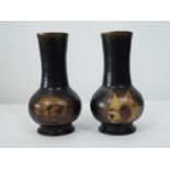 A pair of Victorian papier mache vases with trumpet shaped necks, hand painted panels, showing two