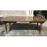 A continental oak pull out extending dining table of rectangular form with moulded outline,
