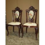 A pair of late Victorian/ Edwardian mahogany occasional chairs with recently re-upholstered
