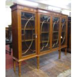 A good quality late Victorian period satin wood breakfront display cabinet enclosed by four astragal